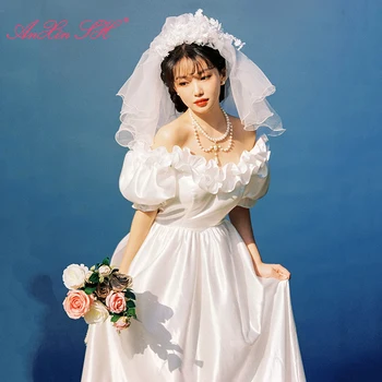 AnXin SH винтажное сватбена рокля на принцеса от бял сатен с къдри ръчно изработени, деколте лодка, кратък буйни ръкав, голям лък, фотография, стари сватбена рокля LZ