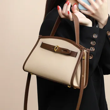 В Европа и Съединените Щати нова нишевая чанта през рамо от висококачествена естествена кожа с текстура на едното рамо.